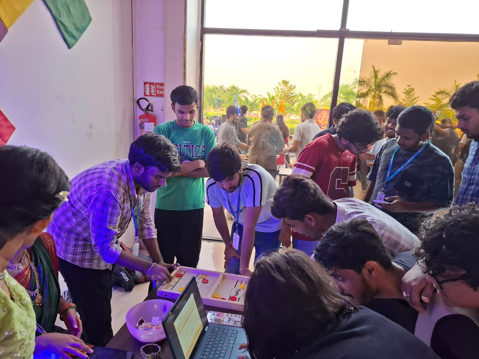 TGC students gathered around a tabletop game at UnCharted — Way of Ganesh